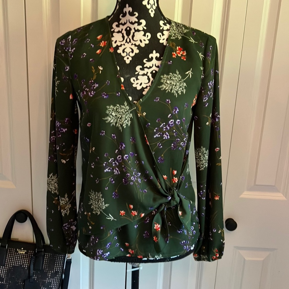 Green with floral print v necked blouse with front panel tie at side